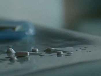 Movie still from “Sam Fender - Dead Boys” (2018), directed by Vincent Haycock – Extreme Close Up shot, Overhead angle