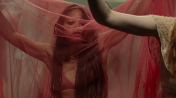 Movie still from “Florence + The Machine - Big God” (2018), directed by Autumn de Wilde – Medium shot, Low angle