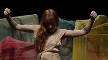 Movie still from “Florence + The Machine - Big God” (2018), directed by Autumn de Wilde – Medium shot, Overhead angle