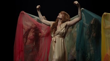 Movie still from “Florence + The Machine - Big God” (2018), directed by Autumn de Wilde – Medium shot, Low angle