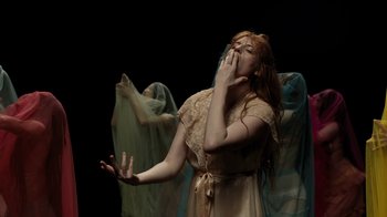 Movie still from “Florence + The Machine - Big God” (2018), directed by Autumn de Wilde – Medium shot, Low angle