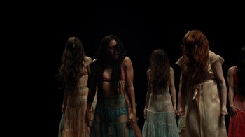 Movie still from “Florence + The Machine - Big God” (2018), directed by Autumn de Wilde – Medium shot, Low angle