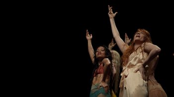 Movie still from “Florence + The Machine - Big God” (2018), directed by Autumn de Wilde – Medium shot, Low angle