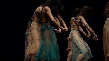 Movie still from “Florence + The Machine - Big God” (2018), directed by Autumn de Wilde – Medium shot, Low angle