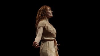 Movie still from “Florence + The Machine - Big God” (2018), directed by Autumn de Wilde – Medium shot, Low angle