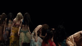 Movie still from “Florence + The Machine - Big God” (2018), directed by Autumn de Wilde – Medium shot, High angle