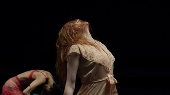 Movie still from “Florence + The Machine - Big God” (2018), directed by Autumn de Wilde – Medium shot, Low angle