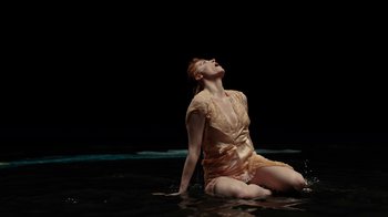 Movie still from “Florence + The Machine - Big God” (2018), directed by Autumn de Wilde – Medium shot, High angle