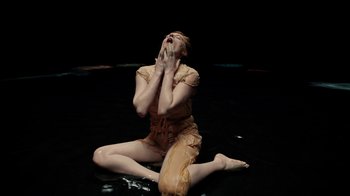 Movie still from “Florence + The Machine - Big God” (2018), directed by Autumn de Wilde – Medium shot, Overhead angle