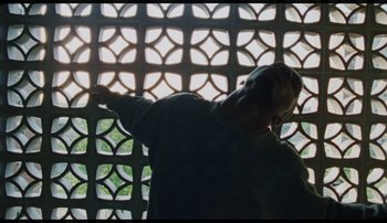 Movie still from “Bearcubs - Underwaterfall” (2018), directed by Salomon Ligthelm – Medium shot, Low angle