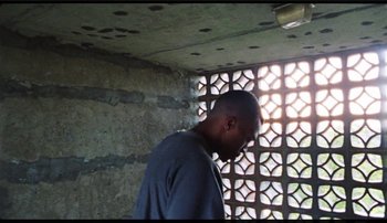 Movie still from “Bearcubs - Underwaterfall” (2018), directed by Salomon Ligthelm – Medium shot, Low angle