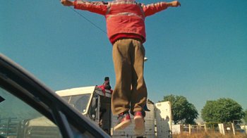 Movie still from “A.CHAL - Cuánto” (2018), directed by Dexter Navy – Medium shot, Low angle