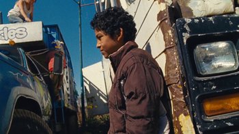 Movie still from “A.CHAL - Cuánto” (2018), directed by Dexter Navy – Medium shot, Low angle