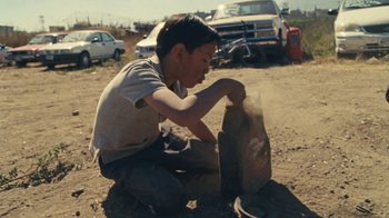 Movie still from “A.CHAL - Cuánto” (2018), directed by Dexter Navy – Medium shot, Low angle