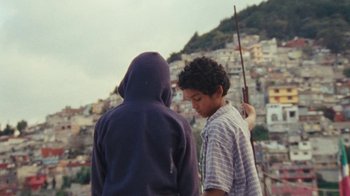 Movie still from “A.CHAL - Cuánto” (2018), directed by Dexter Navy – Medium shot, Over the shoulder angle