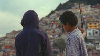 Movie still from “A.CHAL - Cuánto” (2018), directed by Dexter Navy – Medium shot, Over the shoulder angle