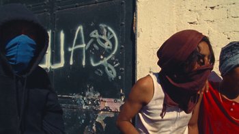 Movie still from “A.CHAL - Cuánto” (2018), directed by Dexter Navy – Medium shot, Low angle