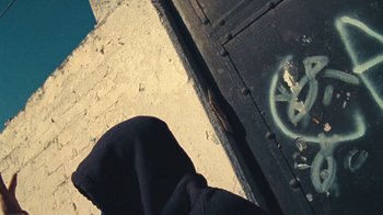 Movie still from “A.CHAL - Cuánto” (2018), directed by Dexter Navy – Extreme Close Up shot, Overhead angle