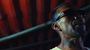 Movie still from “A.CHAL - Cuánto” (2018), directed by Dexter Navy – Close Up shot, Low angle