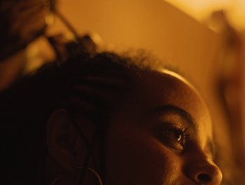 Movie still from “Seinabo Sey - I Owe You Nothing” (2018), directed by Sheila Johansson – Extreme Close Up shot, Low angle