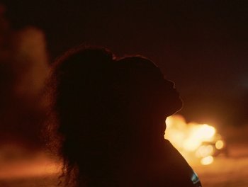 Movie still from “Seinabo Sey - I Owe You Nothing” (2018), directed by Sheila Johansson – Extreme Close Up shot, Low angle