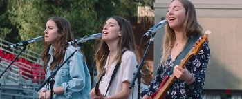 Movie still from “HAIM - Night So Long” (2018), directed by Paul Thomas Anderson – Medium shot, Low angle