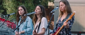 Movie still from “HAIM - Night So Long” (2018), directed by Paul Thomas Anderson – Medium shot, Low angle