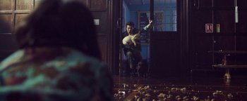 Movie still from “Harry Styles - Kiwi” (2017), directed by Us – Wide shot, Over the shoulder angle
