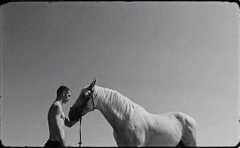 Movie still from “C.Tangana - Caballo Ganador” (2017), directed by Diana Kunst – Medium shot, Low angle