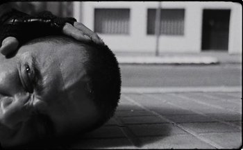 Movie still from “C.Tangana - Caballo Ganador” (2017), directed by Diana Kunst – Extreme Close Up shot, Low angle