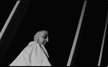 Movie still from “C.Tangana - Caballo Ganador” (2017), directed by Diana Kunst – Medium shot, Low angle