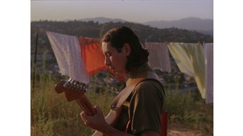 Movie still from “No World - Living Inc.” (2017), directed by Young Replicant – Medium shot, Low angle