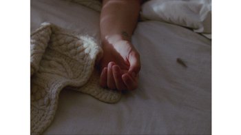 Movie still from “No World - Living Inc.” (2017), directed by Young Replicant – Extreme Close Up shot, Overhead angle