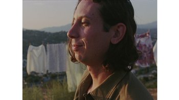 Movie still from “No World - Living Inc.” (2017), directed by Young Replicant – Close Up shot, Low angle