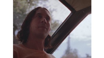 Movie still from “No World - Living Inc.” (2017), directed by Young Replicant – Close Up shot, Low angle