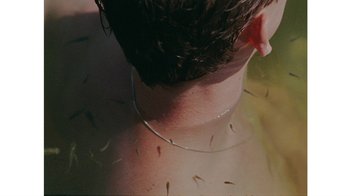 Movie still from “No World - Living Inc.” (2017), directed by Young Replicant – Extreme Close Up shot, Overhead angle