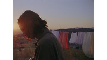 Movie still from “No World - Living Inc.” (2017), directed by Young Replicant – Medium shot, Low angle