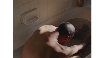 Movie still from “No World - Living Inc.” (2017), directed by Young Replicant – Medium shot, Overhead angle