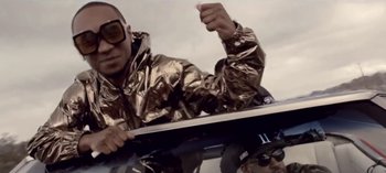 Movie still from “Mike WiLL Made-It - Perfect Pint” (2017), directed by Nabil Elderkin – Medium shot, Low angle