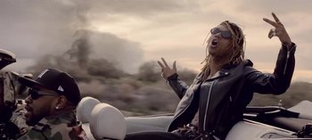 Movie still from “Mike WiLL Made-It - Perfect Pint” (2017), directed by Nabil Elderkin – Medium shot, Low angle