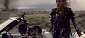 Movie still from “Mike WiLL Made-It - Perfect Pint” (2017), directed by Nabil Elderkin – Medium shot, Low angle