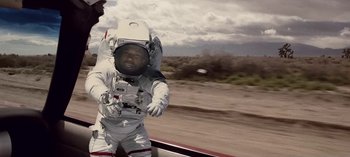 Movie still from “Mike WiLL Made-It - Perfect Pint” (2017), directed by Nabil Elderkin – Medium shot, Low angle