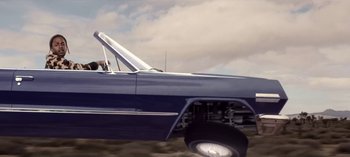 Movie still from “Mike WiLL Made-It - Perfect Pint” (2017), directed by Nabil Elderkin – Medium shot, Low angle