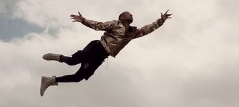 Movie still from “Mike WiLL Made-It - Perfect Pint” (2017), directed by Nabil Elderkin – Medium shot, Low angle