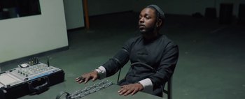 Movie still from “Kendrick Lamar - DNA.” (2017), directed by Nabil Elderkin – Medium shot, High angle