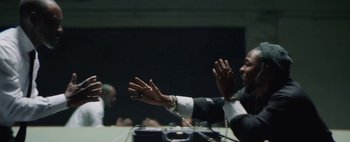 Movie still from “Kendrick Lamar - DNA.” (2017), directed by Nabil Elderkin – Medium shot, Low angle