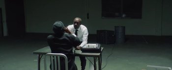 Movie still from “Kendrick Lamar - DNA.” (2017), directed by Nabil Elderkin – Medium shot, Over the shoulder angle
