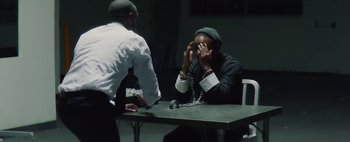 Movie still from “Kendrick Lamar - DNA.” (2017), directed by Nabil Elderkin – Medium shot, Low angle