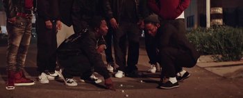 Movie still from “Kendrick Lamar - DNA.” (2017), directed by Nabil Elderkin – Medium shot, Low angle