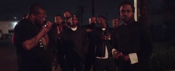 Movie still from “Kendrick Lamar - DNA.” (2017), directed by Nabil Elderkin – Medium shot, Low angle